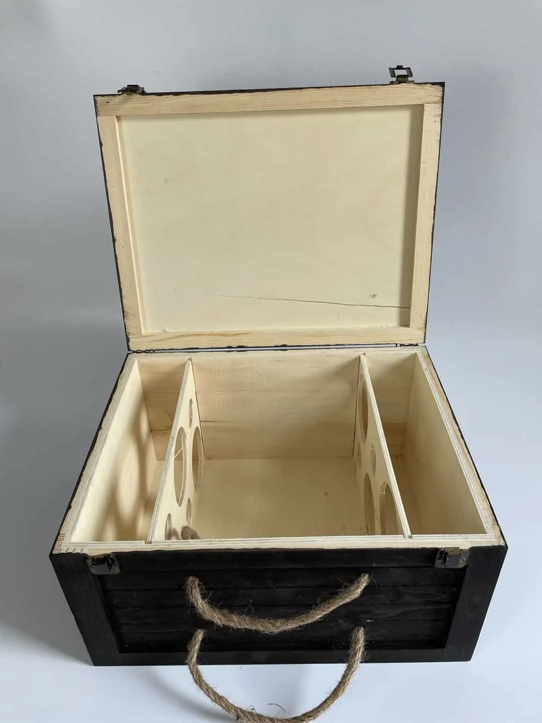 Open 6-bottle wooden wine crate with dividers showing staggered bottle arrangement that optimizes internal space.