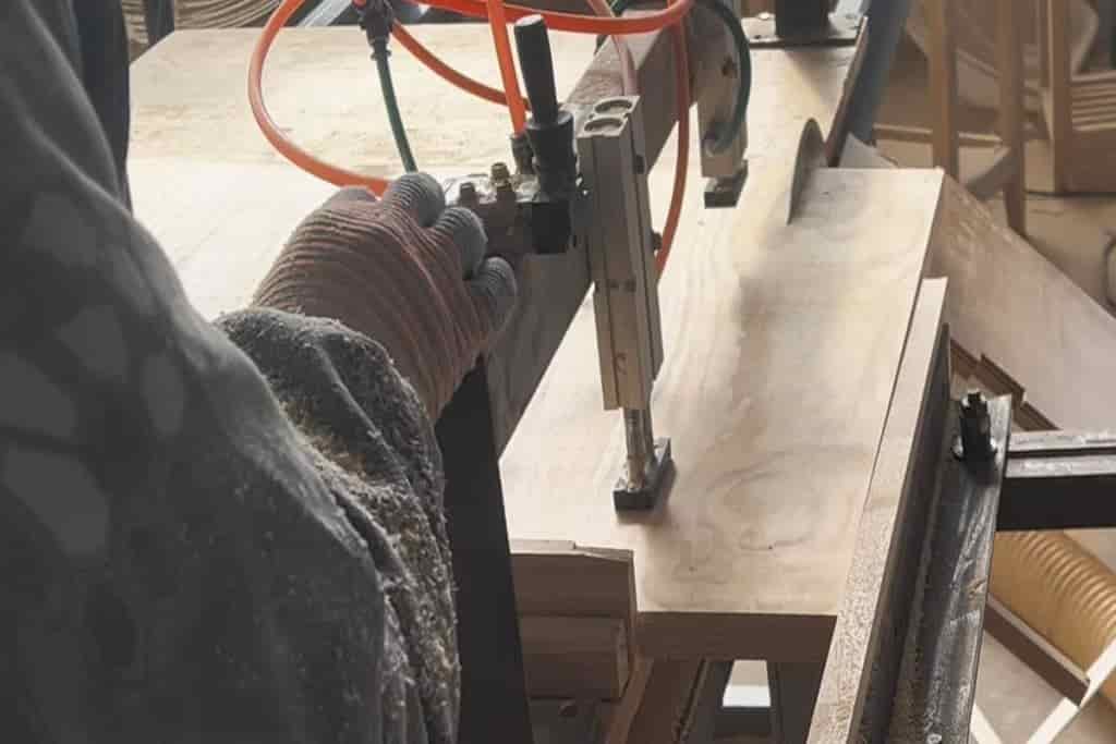 Cutting wooden panels at Hilon custom wood products manufacturing facility